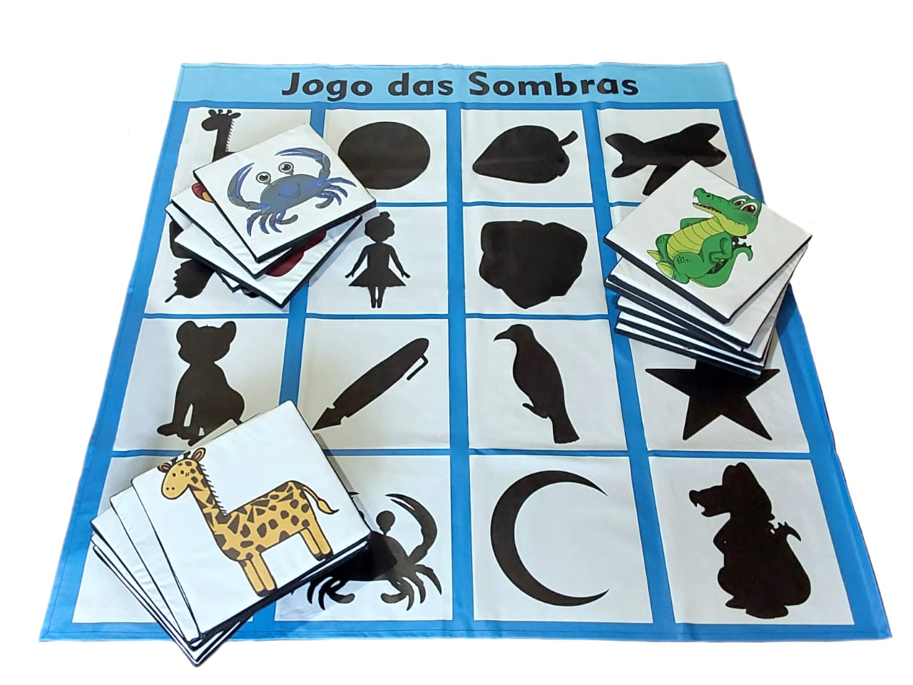 Jogo das Sombras LDM – tapete com silhuetas e peças ilustradas Jogo das Sombras LDM – tapete com silhuetas e peças ilustradas